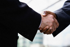 Businessmen Shaking Hands --- Image by © Corbis